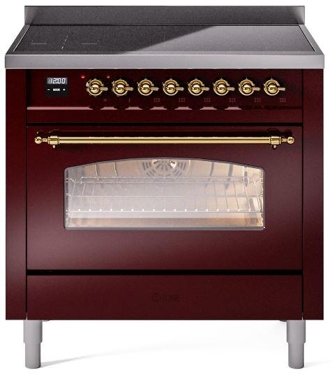 Burgundy induction range front with brass knobs, glass oven door window, and side rails