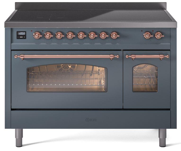 Blue-grey freestanding induction range with copper trim, glass oven door, and control knobs.
