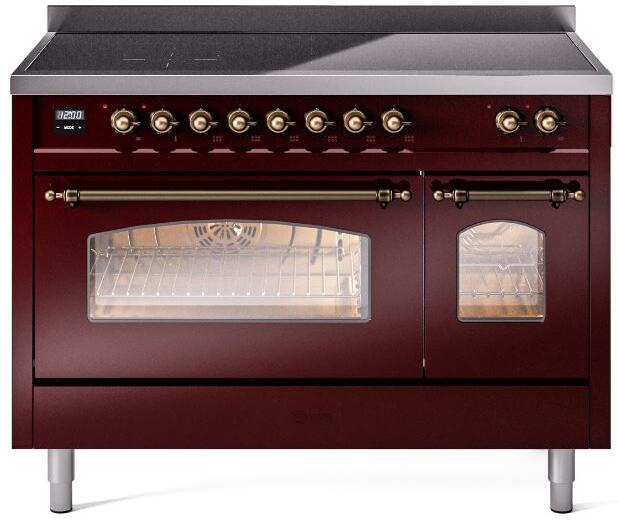 Burgundy freestanding induction range with bronze trim, oven windows, and control knobs