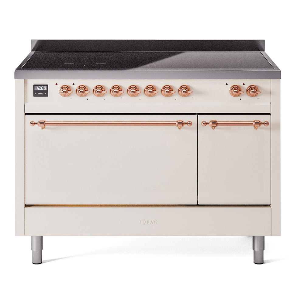 Antique white induction range with copper control knobs and warming drawer doors
