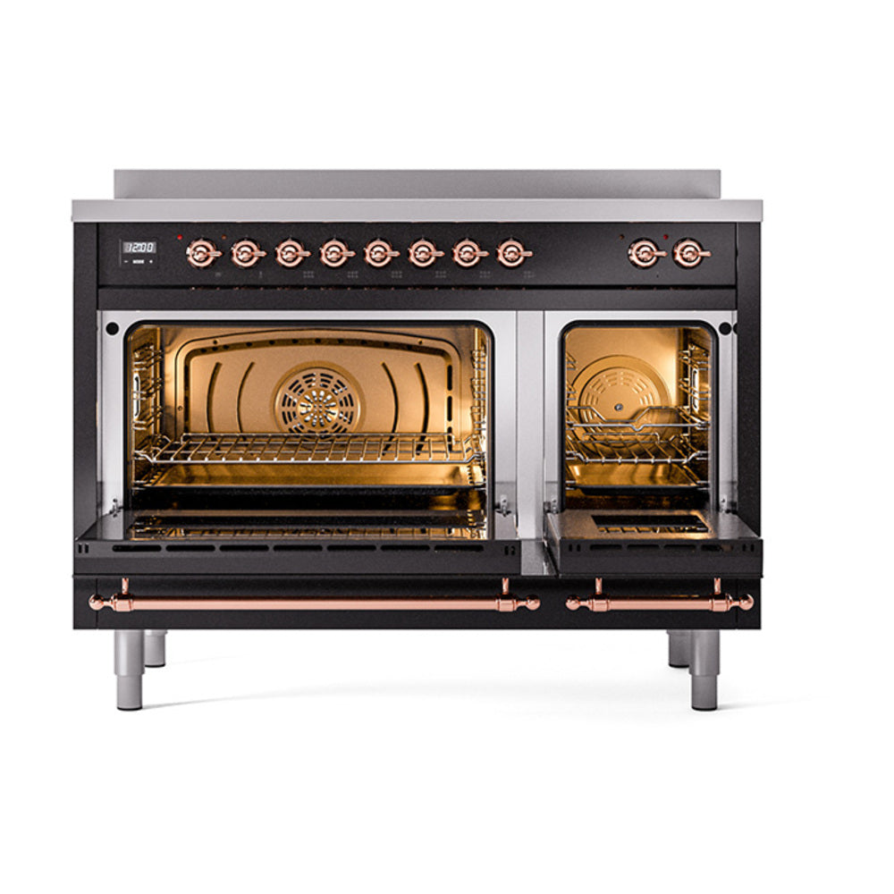 Black induction range with open oven, copper-trimmed racks and warm interior light