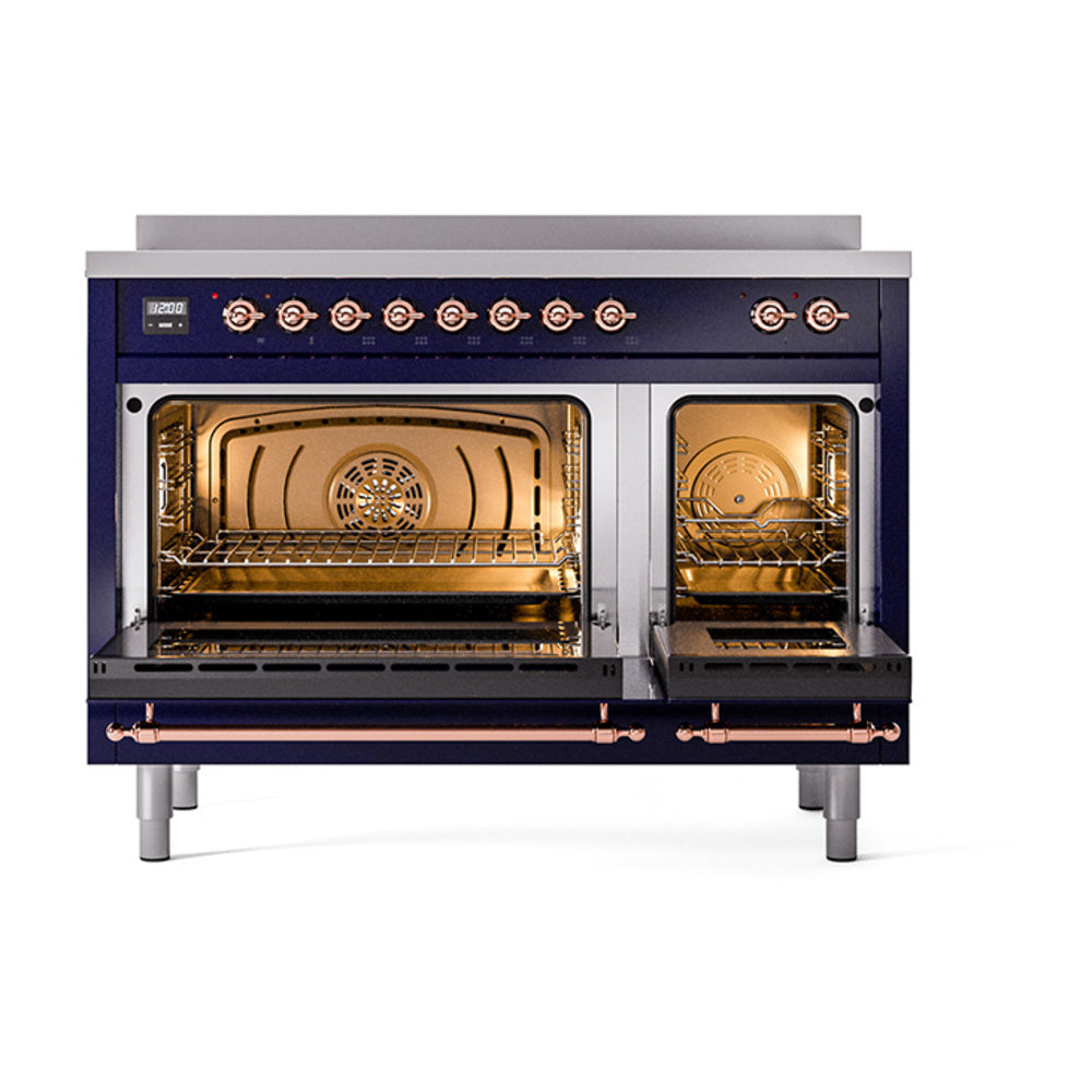 Midnight blue range with brass knobs; oven doors open showing racks