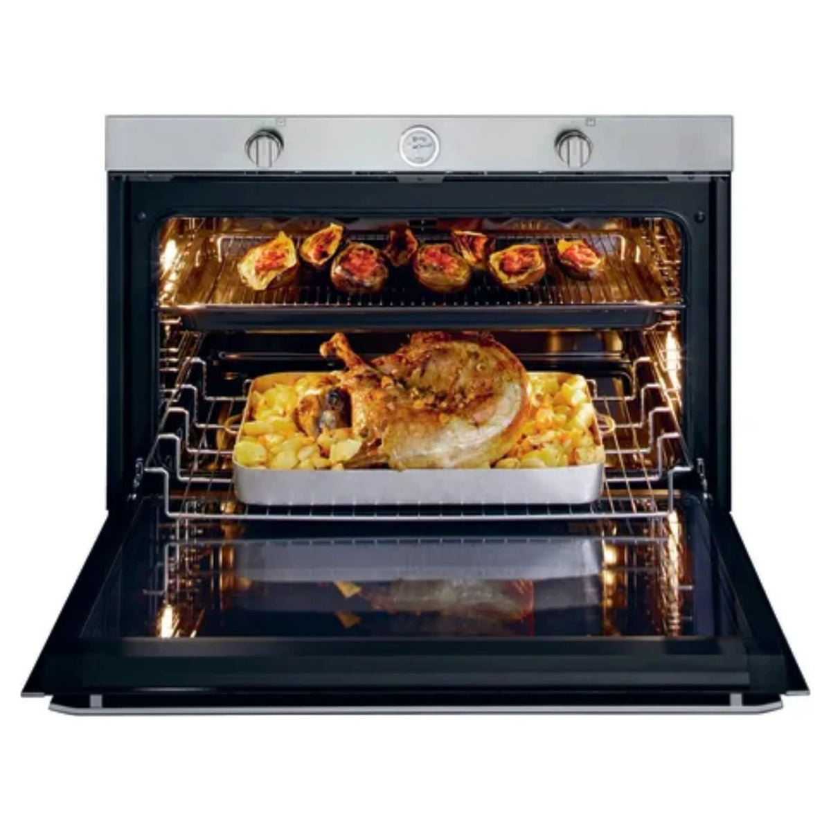 Stainless steel gas built-in single wall oven with lit interior and roasting dish