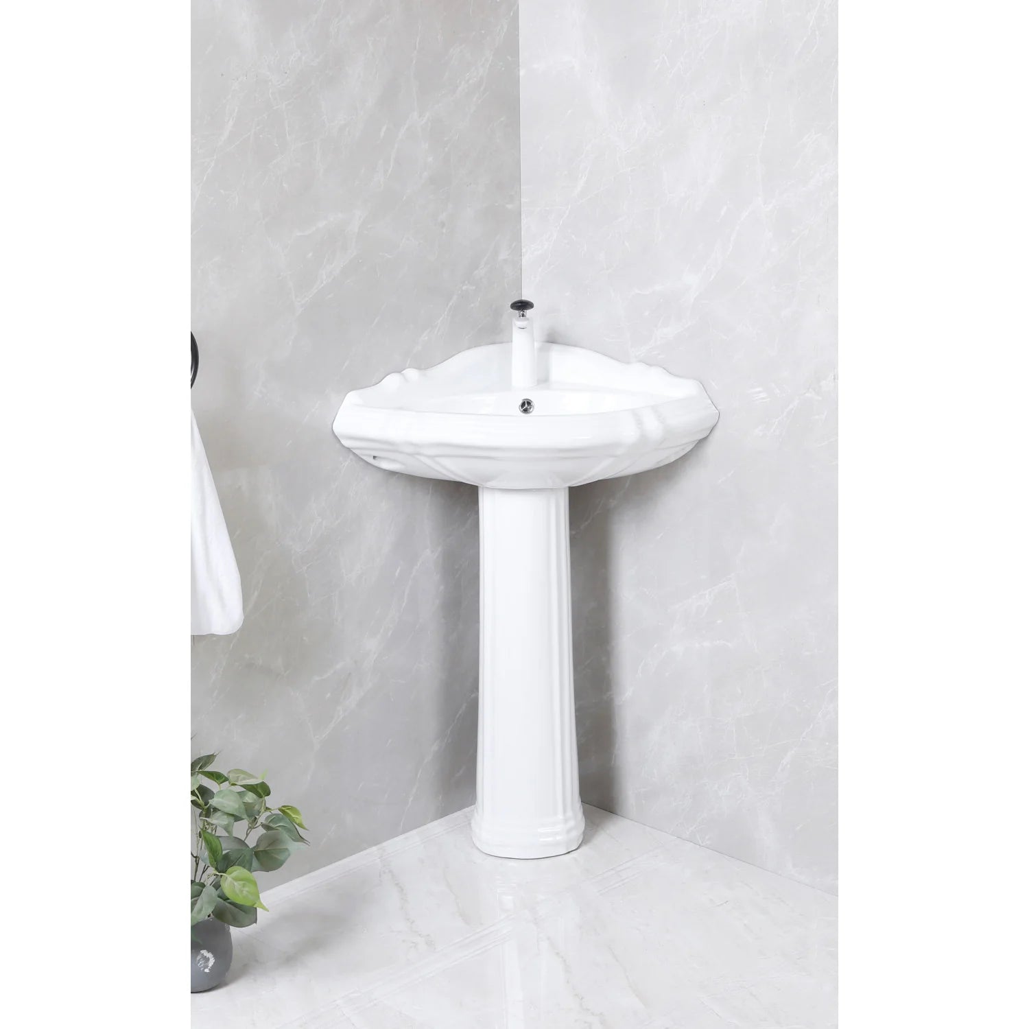 Glossy white ceramic corner pedestal sink with rounded basin and center faucet hole