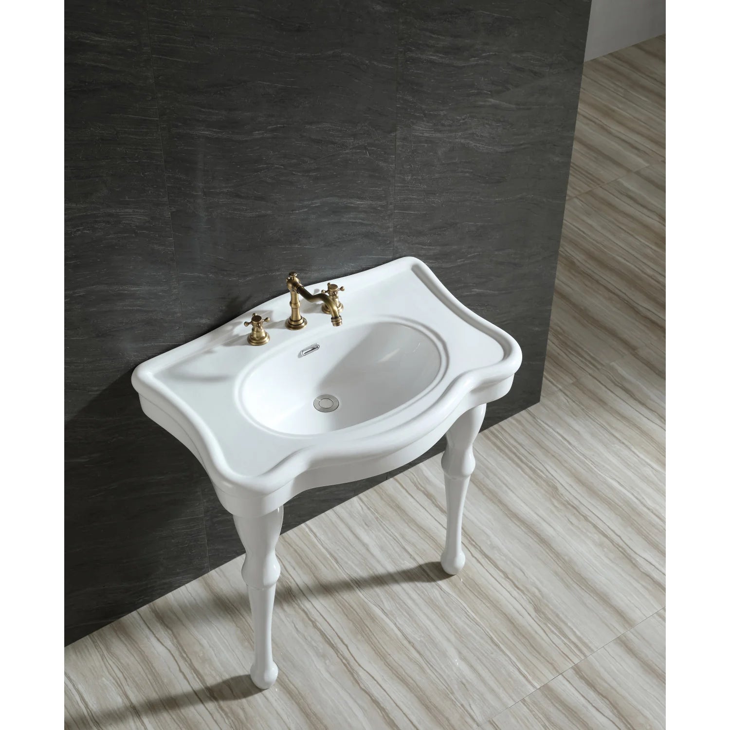 White ceramic console sink with gold deck-mount faucet, oval basin and pedestal legs