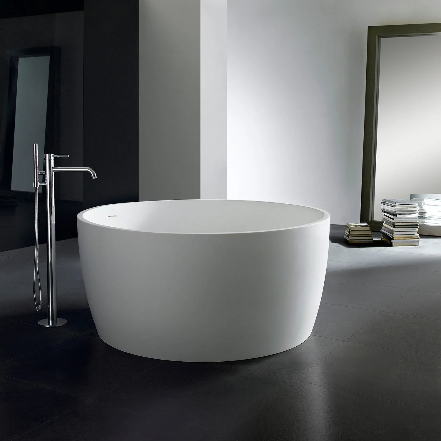 Matte white round freestanding soaking tub with wide floorstanding base