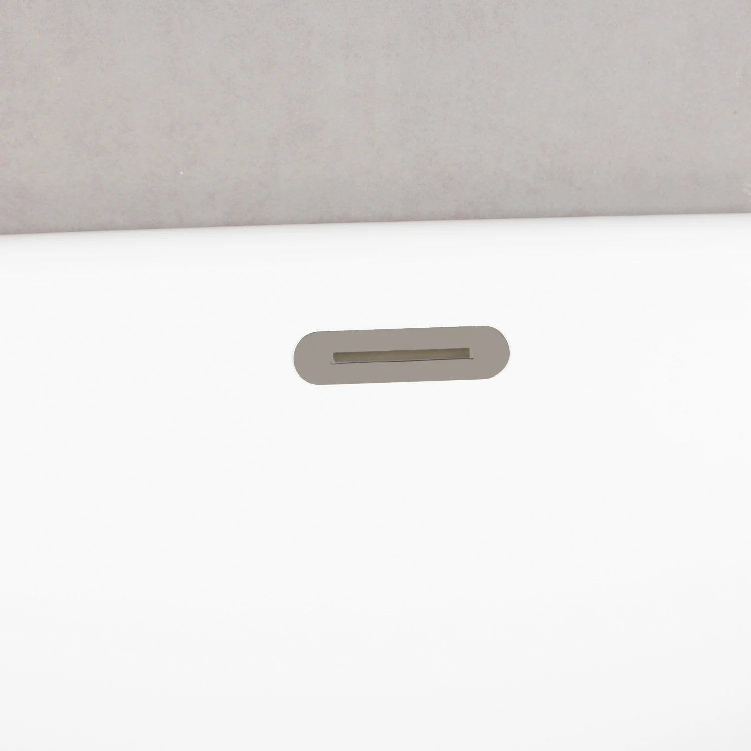 Glossy white oval acrylic tub with brushed-nickel overflow slot