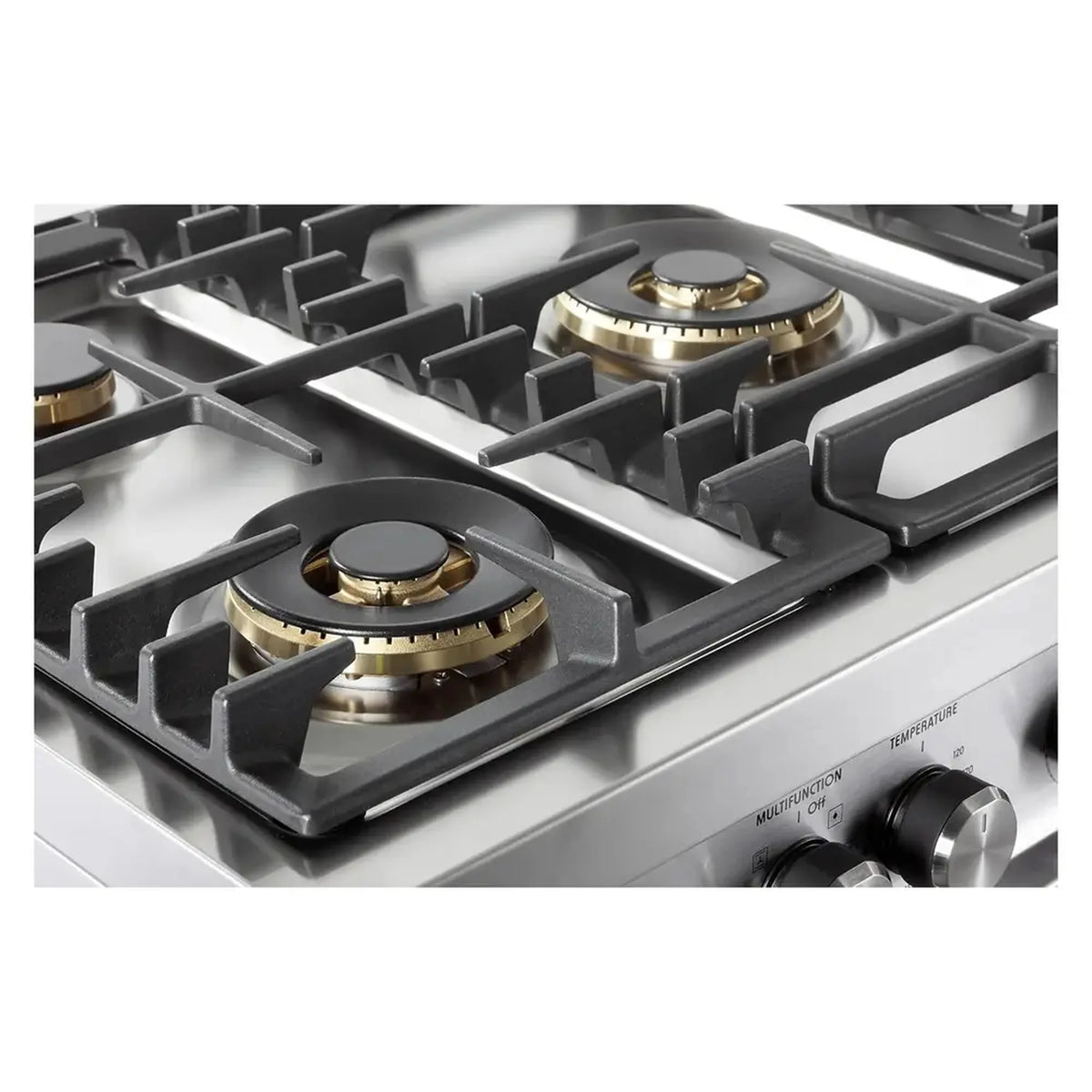 Close-up of five sealed burners on a stainless steel dual fuel range cooktop