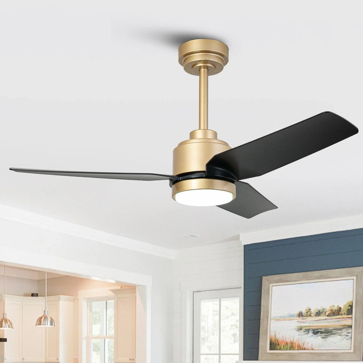 Golden ceiling fan with three black blades and central light housing