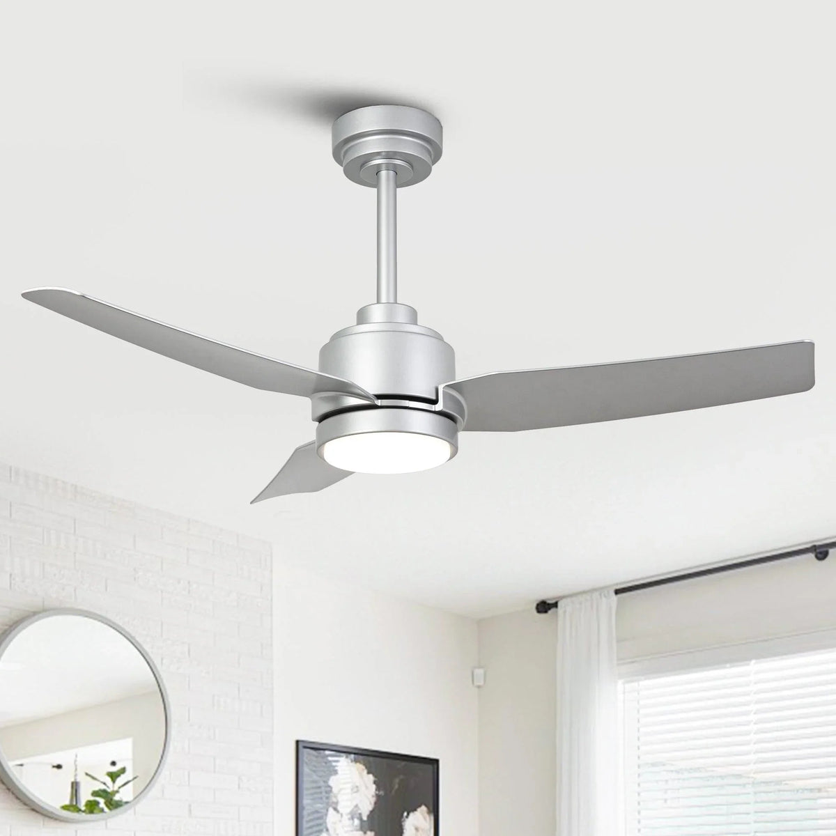 Ceiling fan with silver motor housing and three gray blades