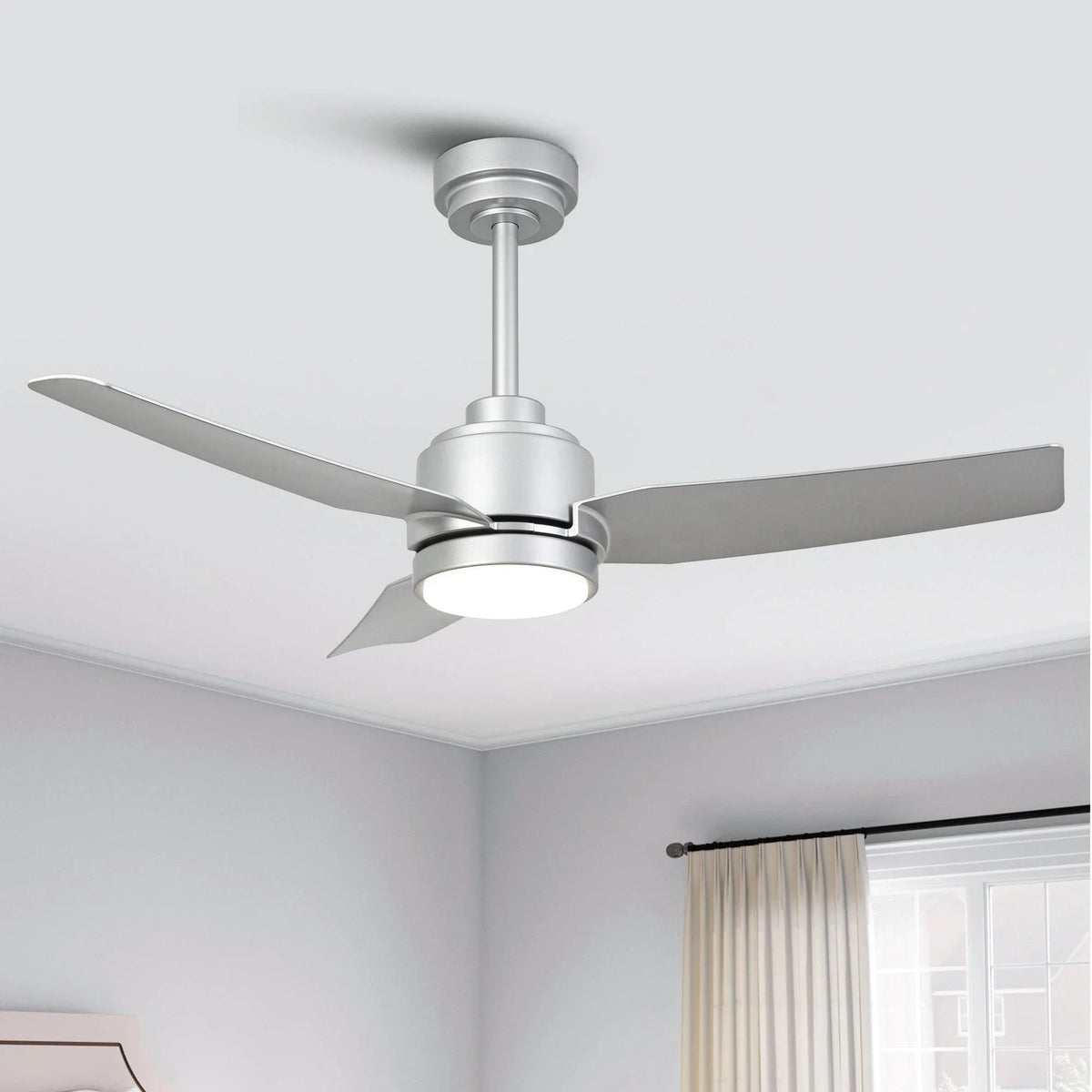 Ceiling fan with silver housing, four arms, and three swept blades