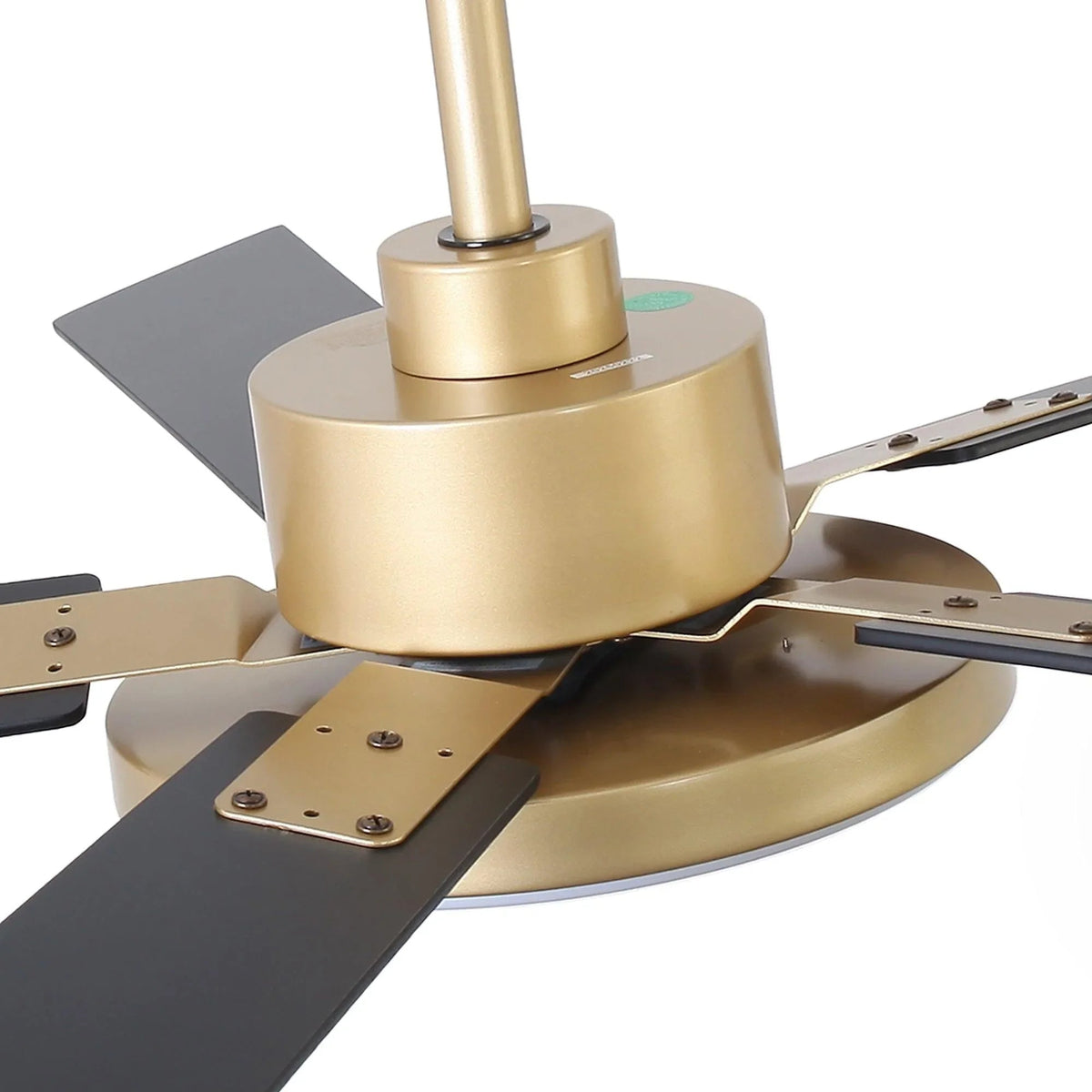 Close-up of gold motor base with double-sided mounting brackets and blades