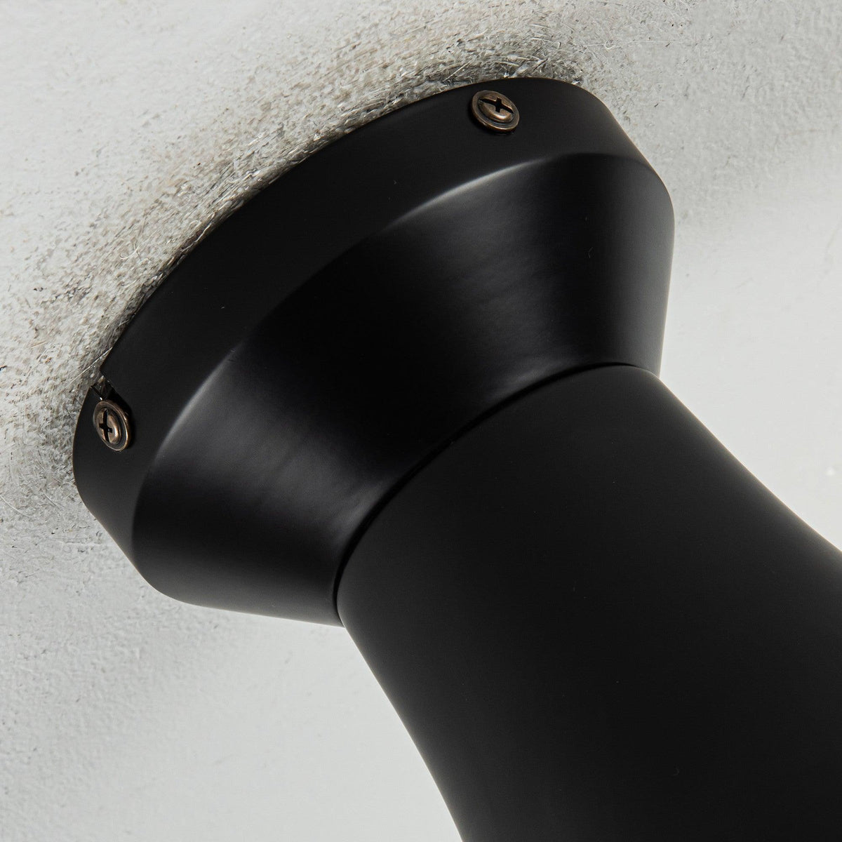 Black flush mount ceiling fan motor housing with mounting plate
