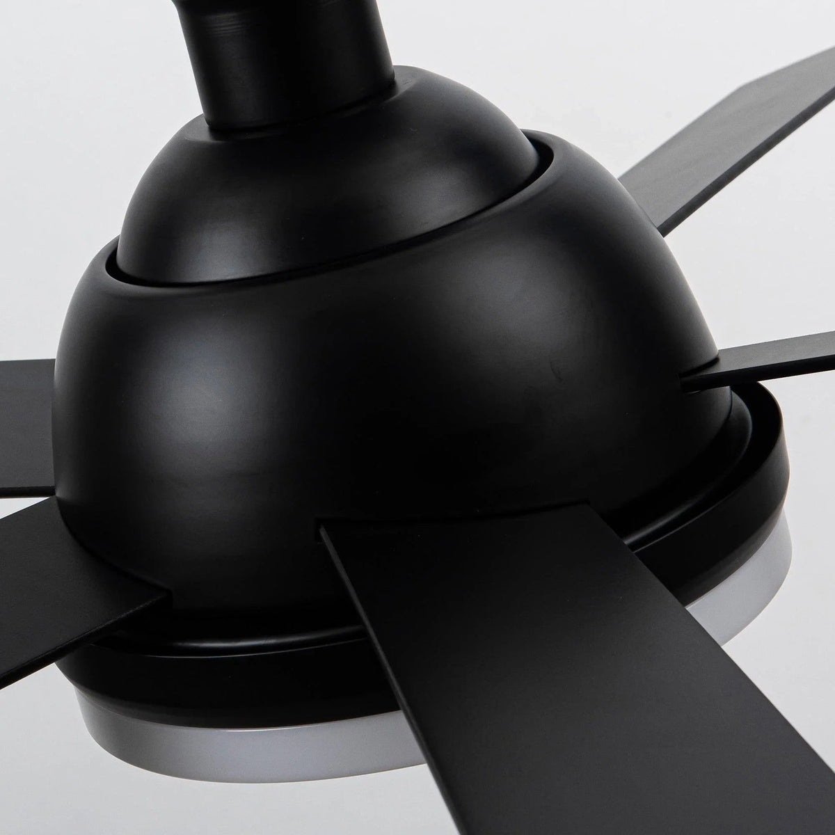 Black ceiling fan motor housing with dark fan blade