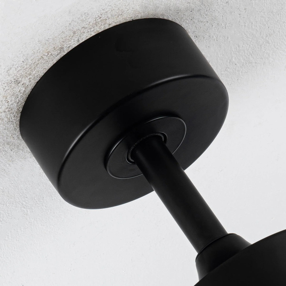 Black DC motor ceiling fan downrod and motor housing detail