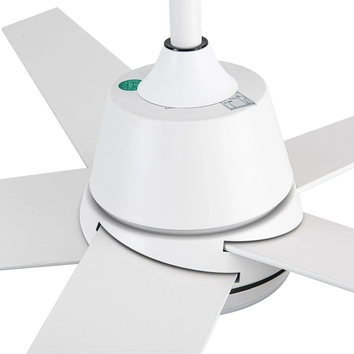 Close-up of white ceiling fan motor base, five blades, and round LED cover