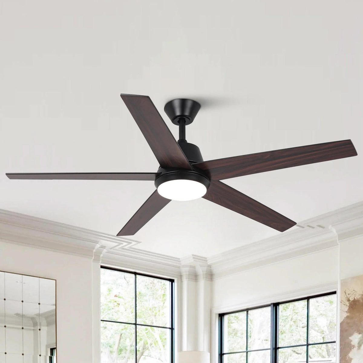Dark ceiling fan with five blades and round LED light centered on the motor