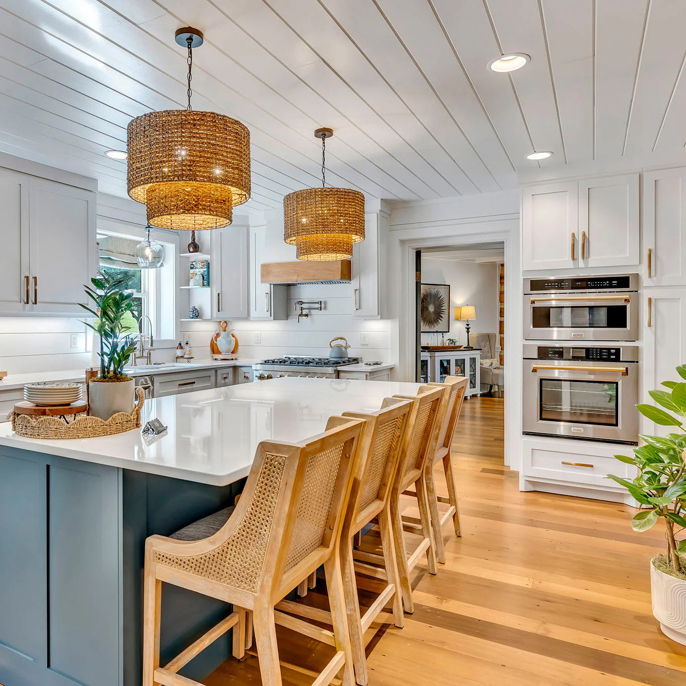 Built-in stainless steel oven and microwave set with gold-trim accents in kitchen