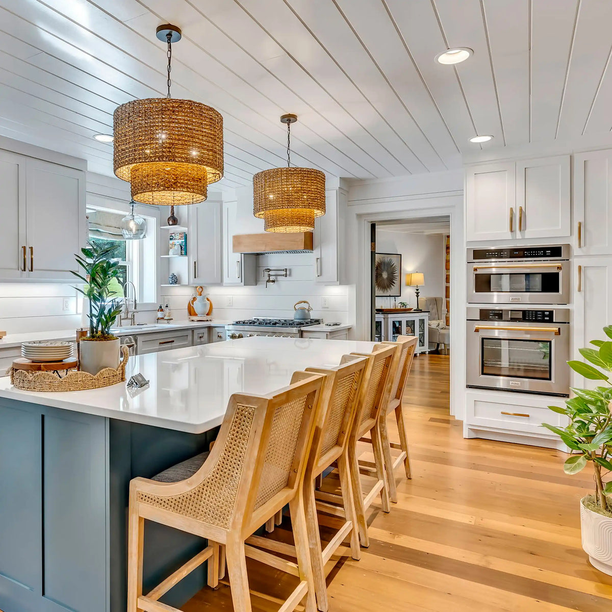 Stainless built-in oven with gold handle among modern kitchen appliances