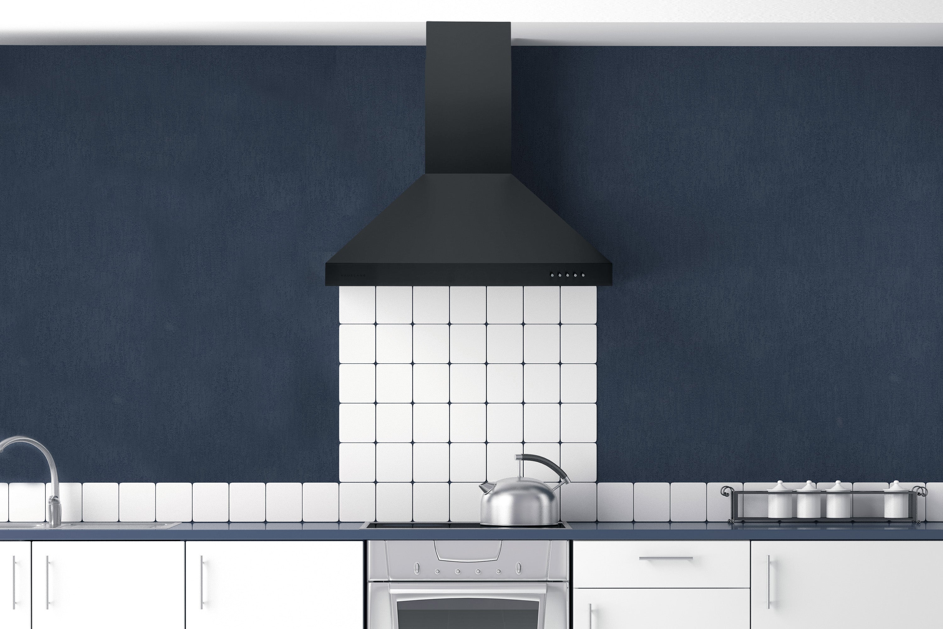 Matte black range hood over a stove in a kitchen, with chimney and vent