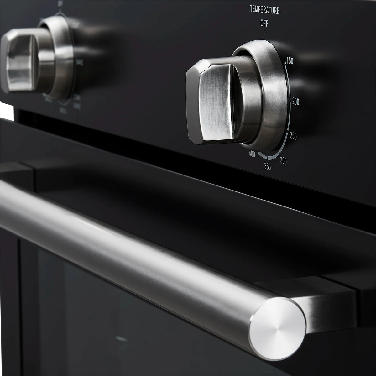 Wall oven control panel detail with stainless knobs and temperature dial labels