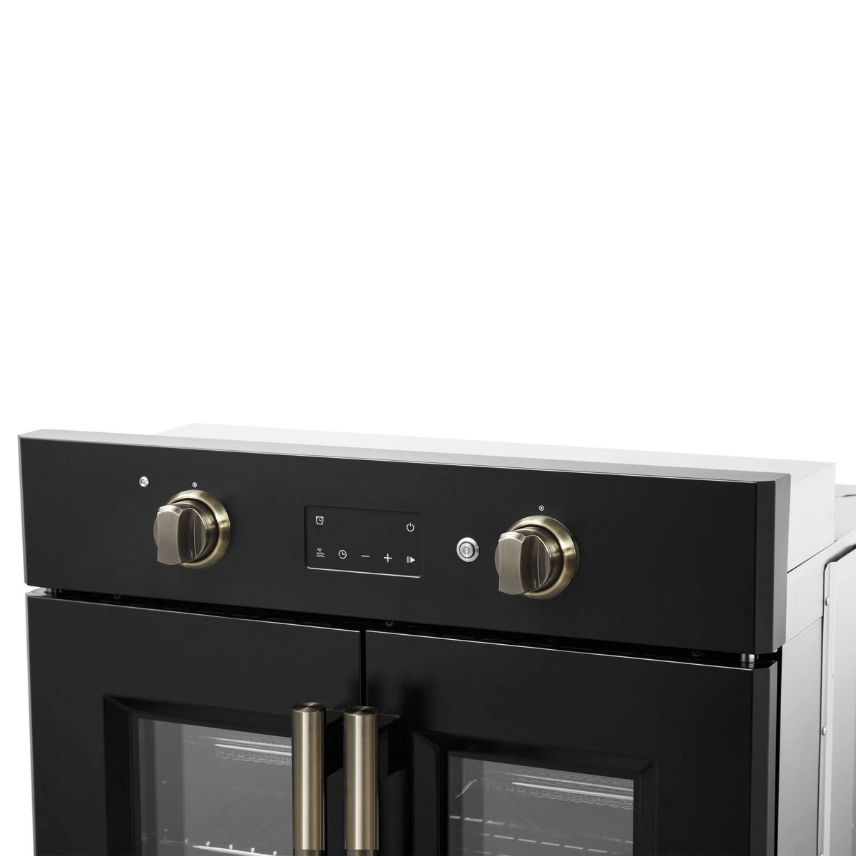 Black oven control panel with two antique brass knobs and central display
