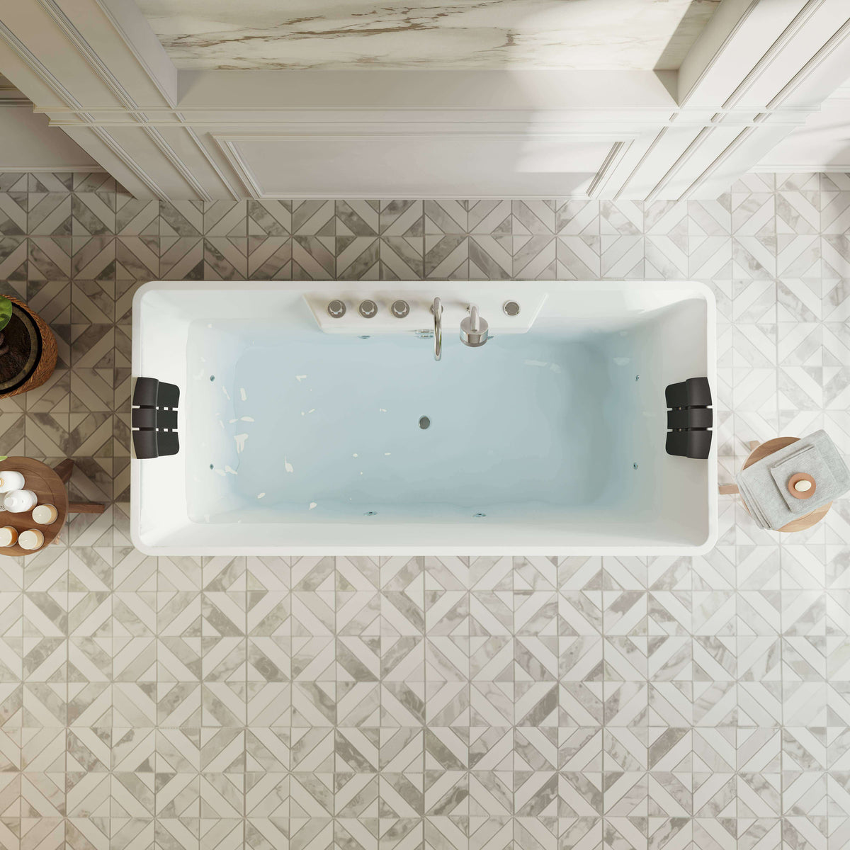 White freestanding acrylic whirlpool bathtub with black headrests and chrome jets, overhead view.