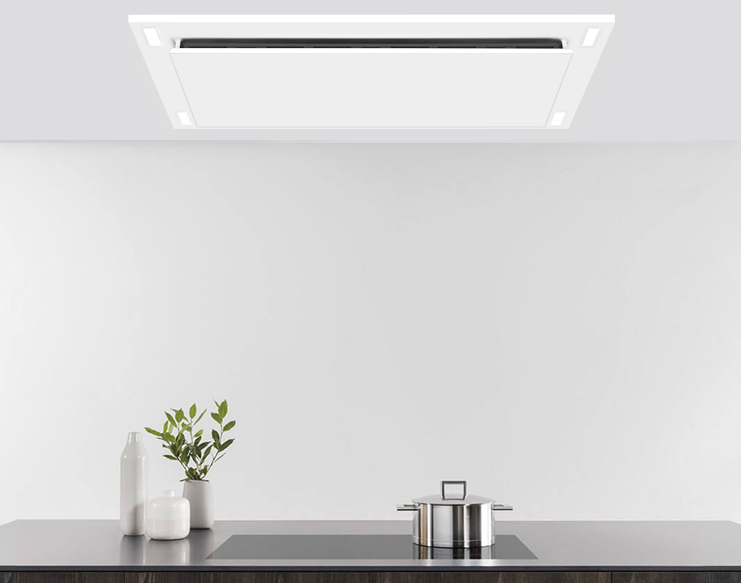 White flush-mount ceiling range hood with slim vent opening and LED light strip