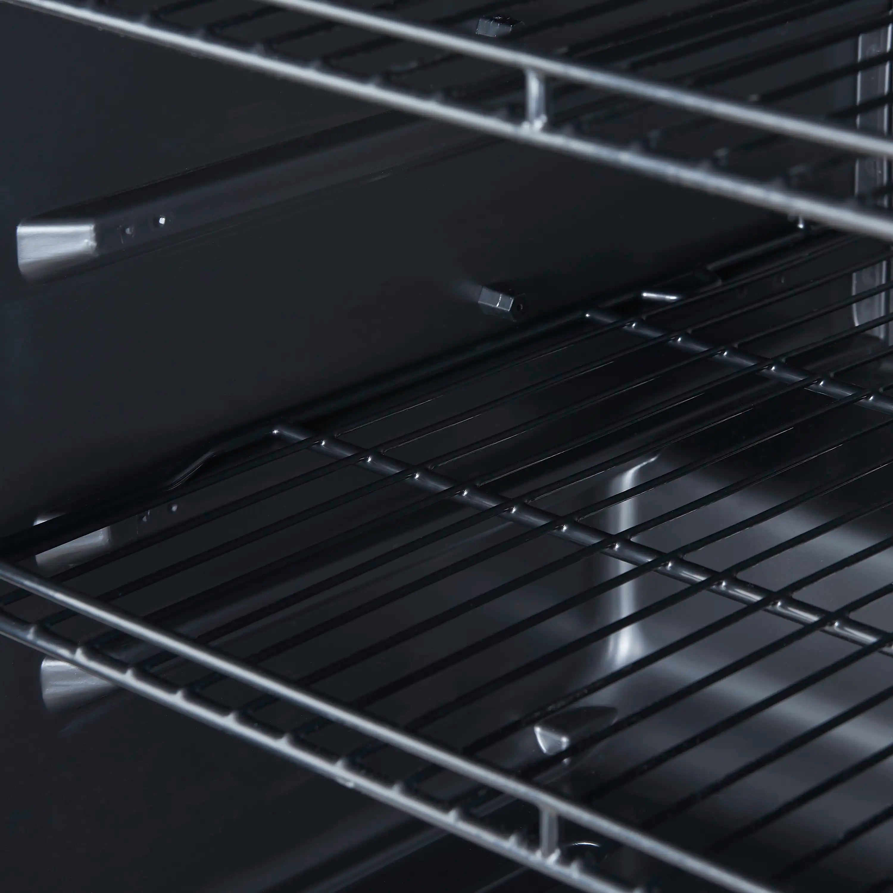 Wire shelving inside wine cooler with metal rails and storage space