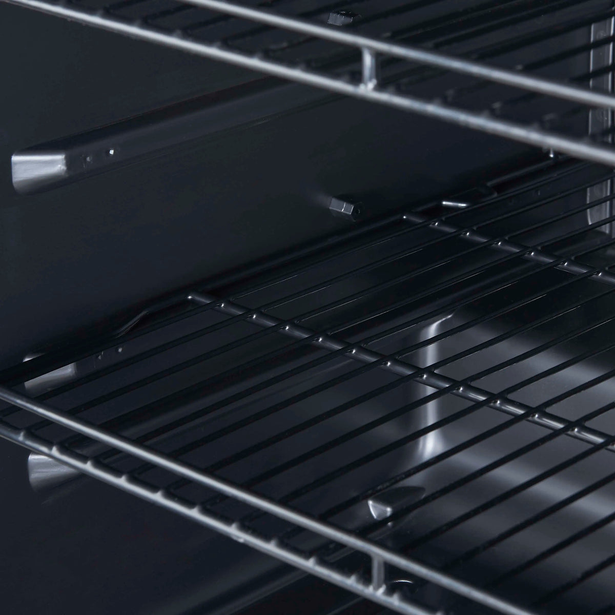 Wire shelf rack inside a beverage cooler with metal rails