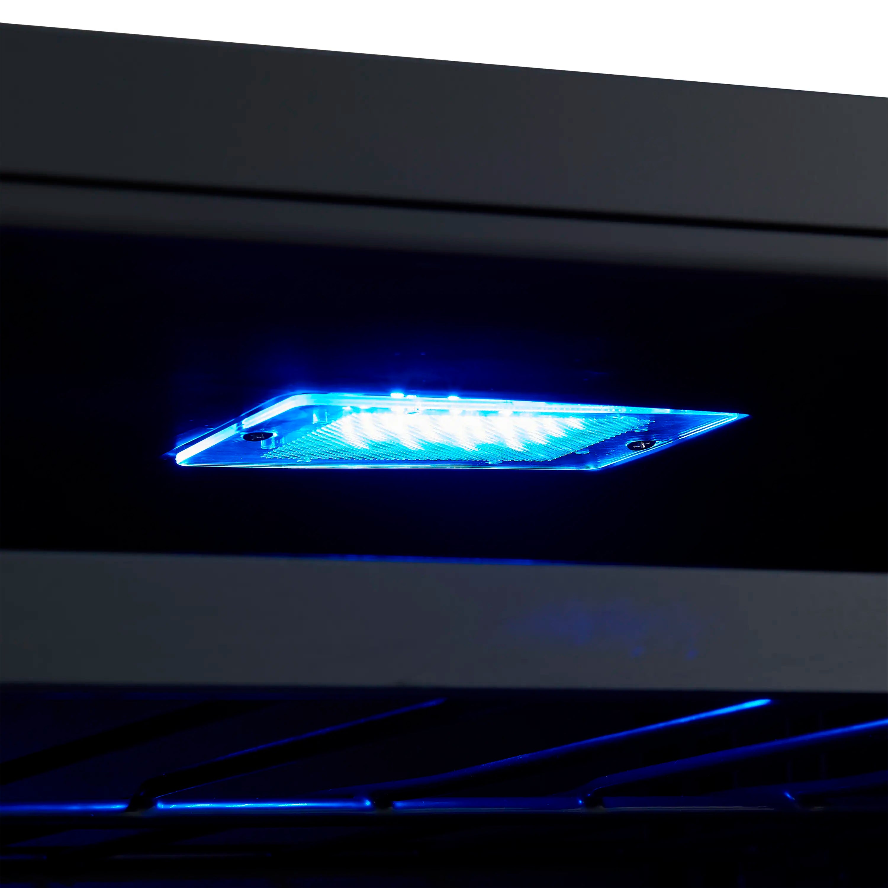 Wine and beverage cooler interior with bright blue LED light and upper shelf