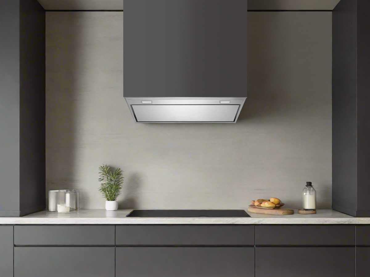 Stainless steel insert range hood installed under cabinet over a cooktop