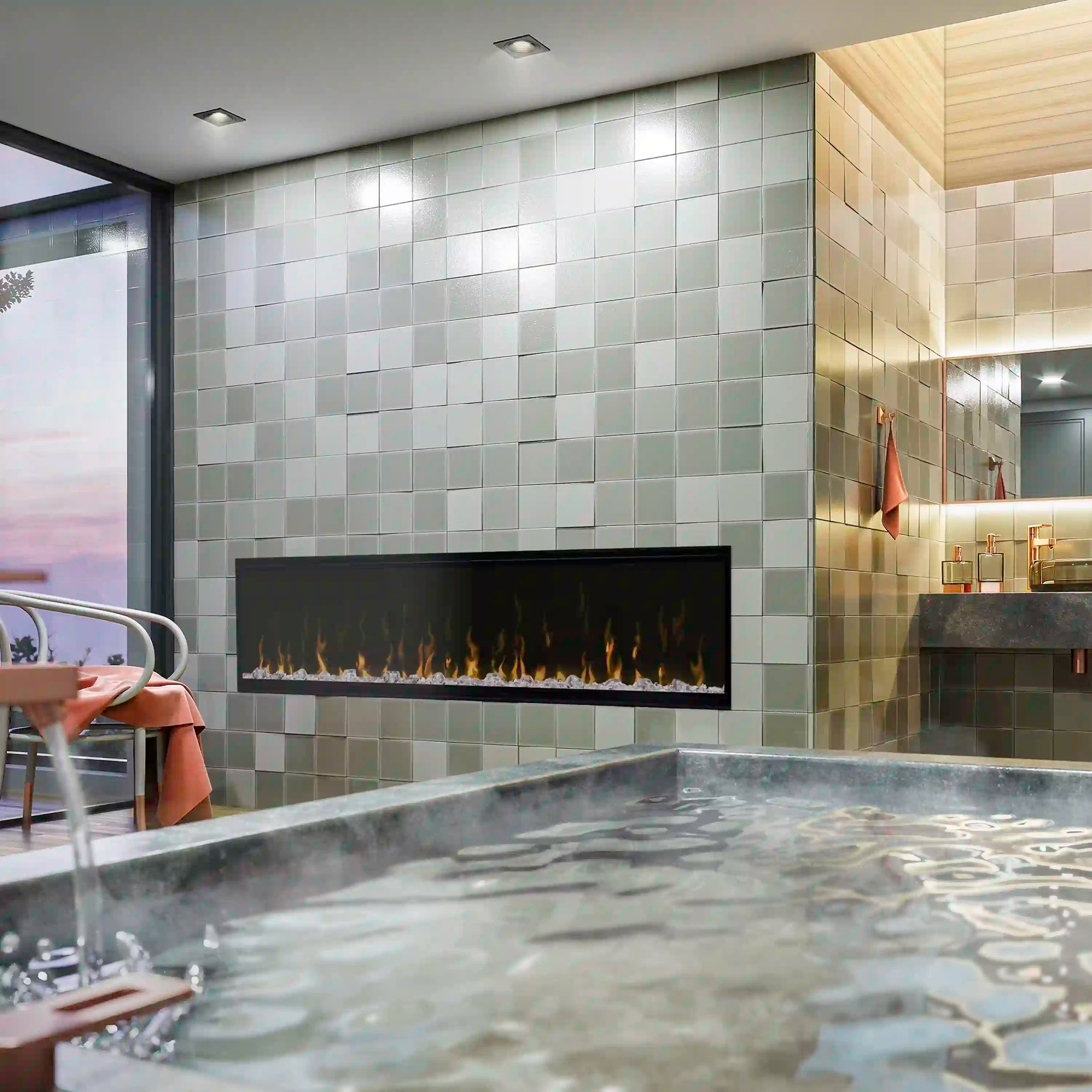 Linear electric fireplace insert with black glass front and flame display on tiled wall