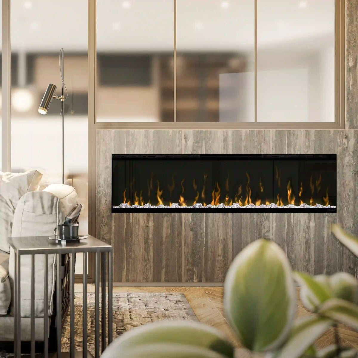 Linear electric fireplace insert with black front showing flames and ember bed