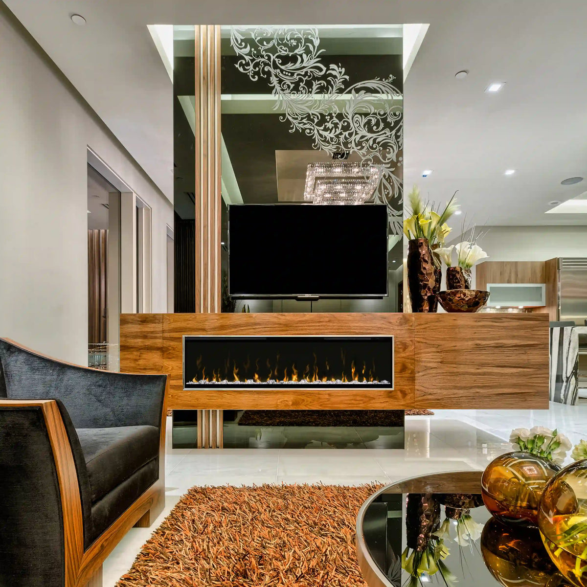 Built-in linear electric fireplace insert with black glass front and glowing flame bed