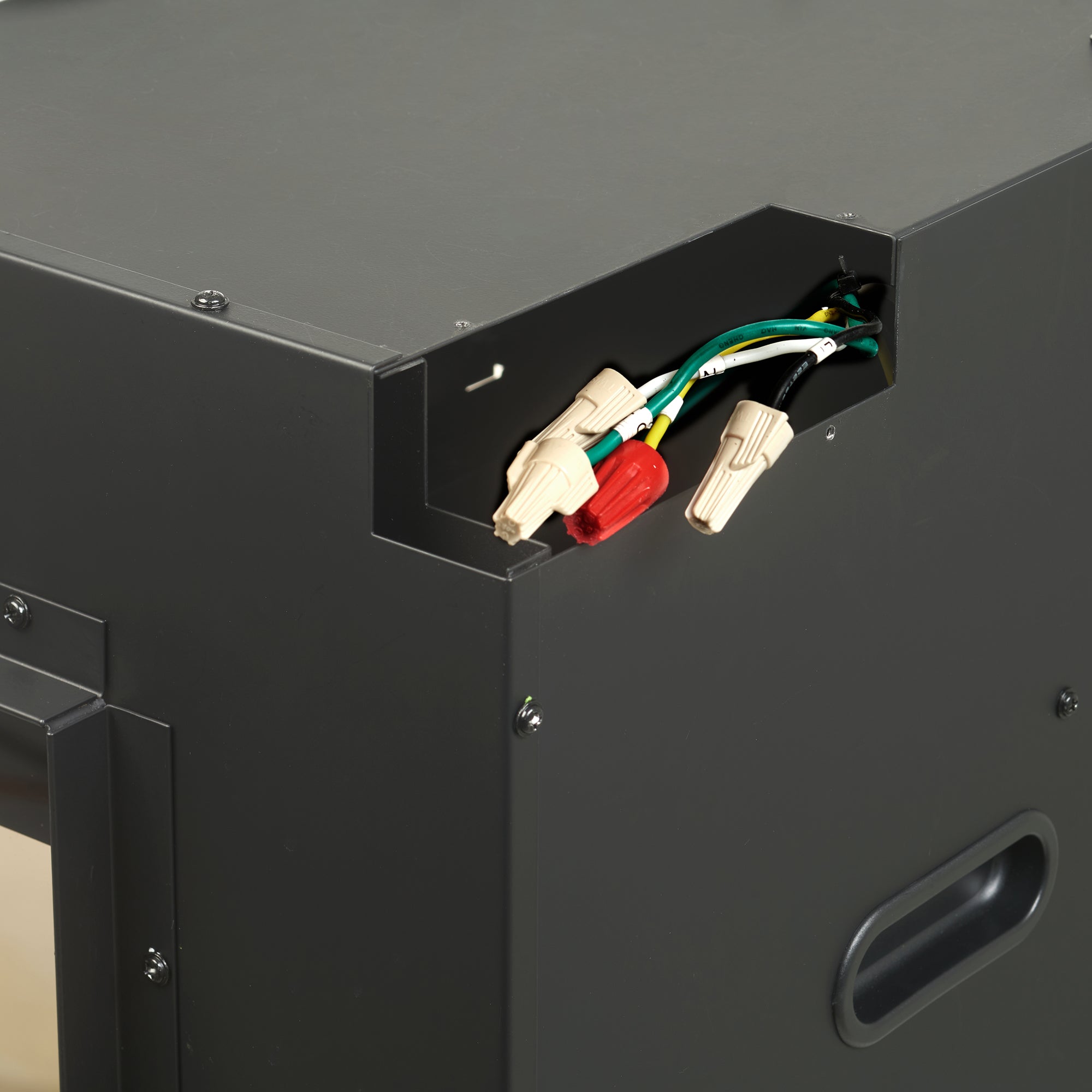 Black built-in linear electric fireplace cabinet showing exposed wiring terminals inside