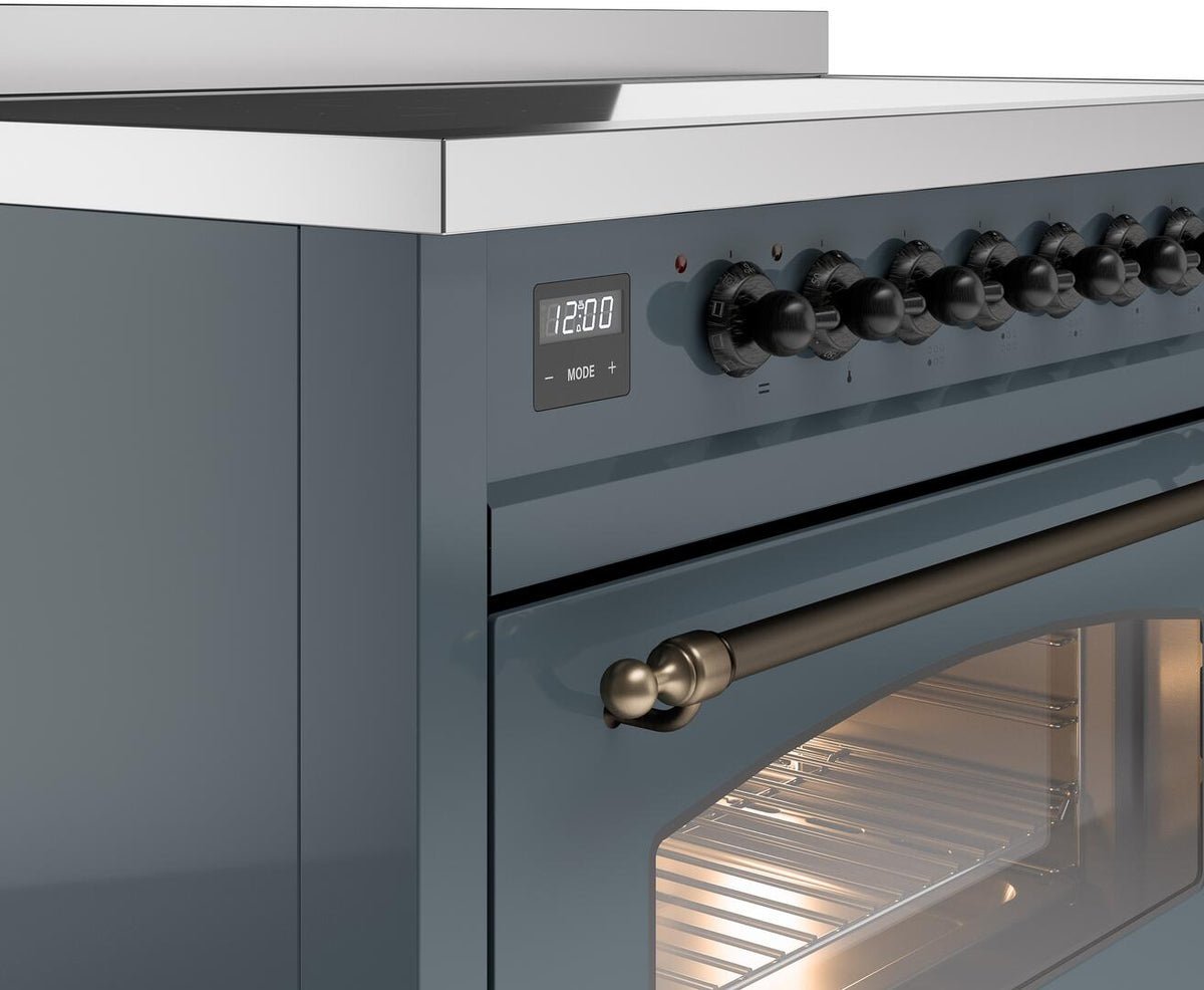 Induction cooktop control panel with knob row, display, and bronze oven handle