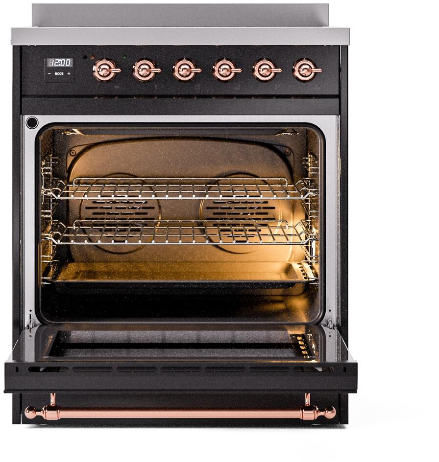 Open oven of glossy black induction range with copper control knobs and wire racks