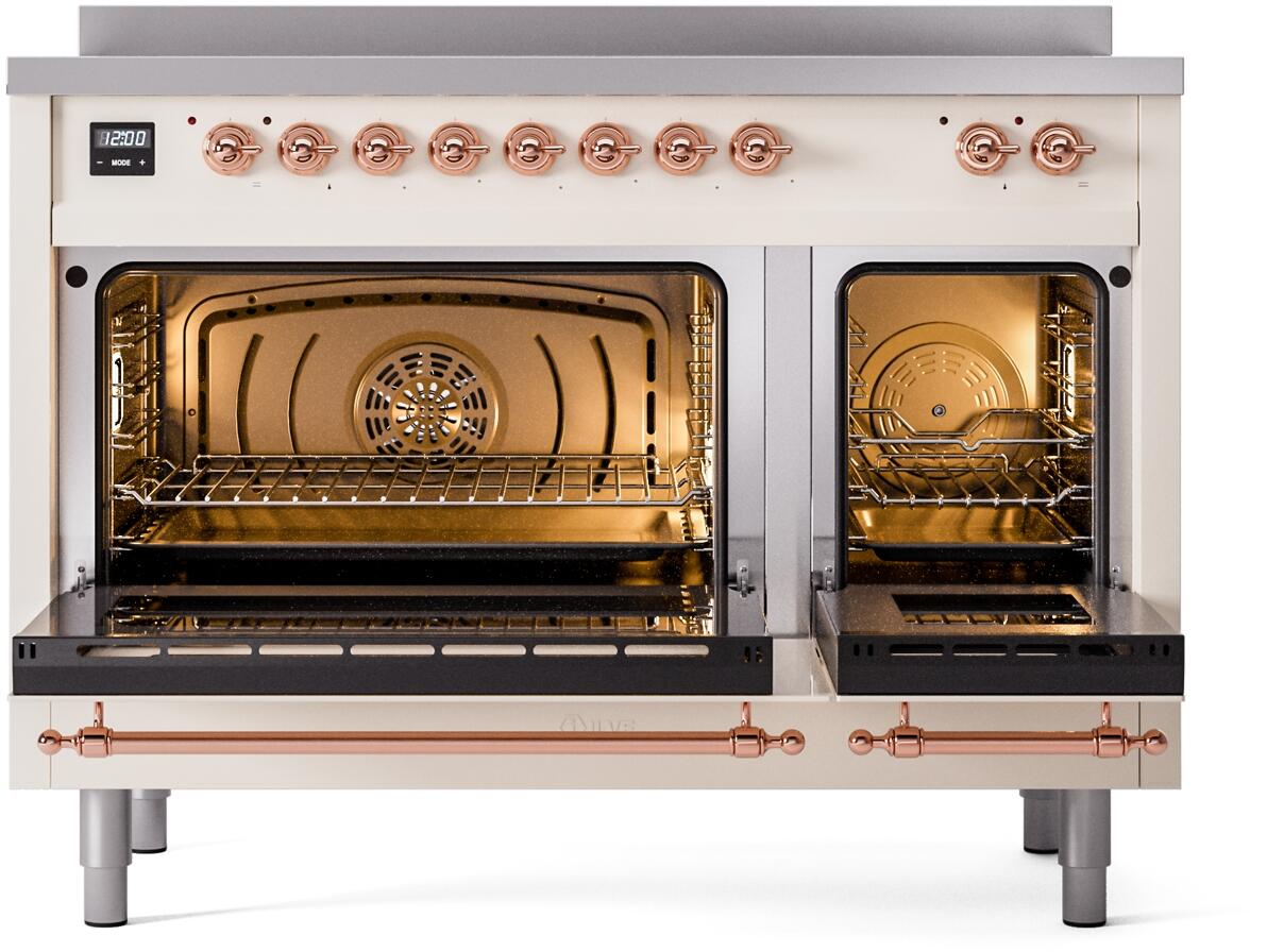 Antique white electric induction range with one oven door open and copper handle bars
