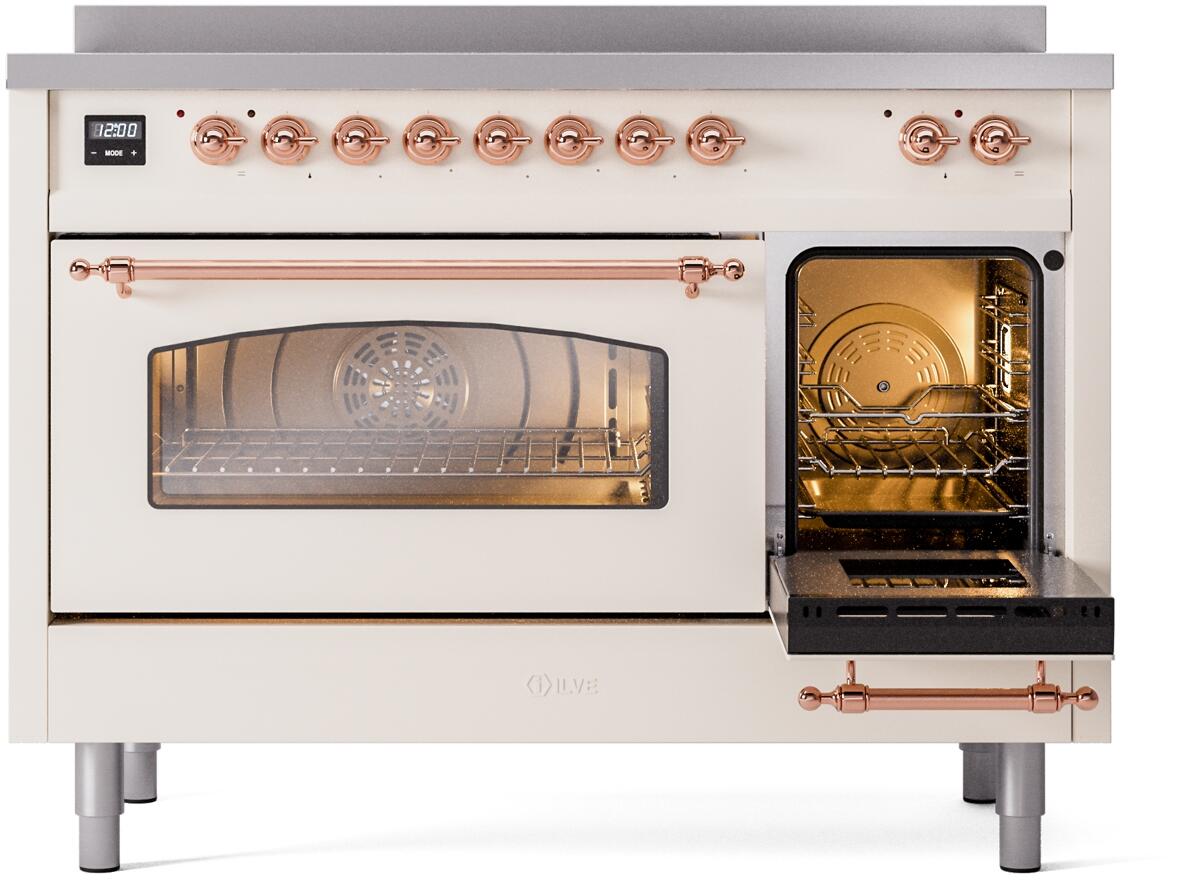 Antique white electric induction range with both oven doors open and copper trim