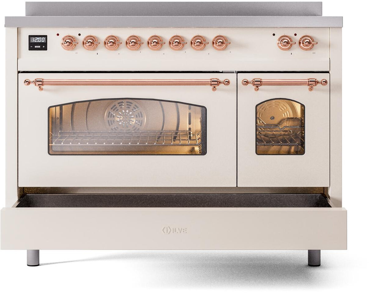 Antique white electric induction range with glass oven windows and copper control knobs