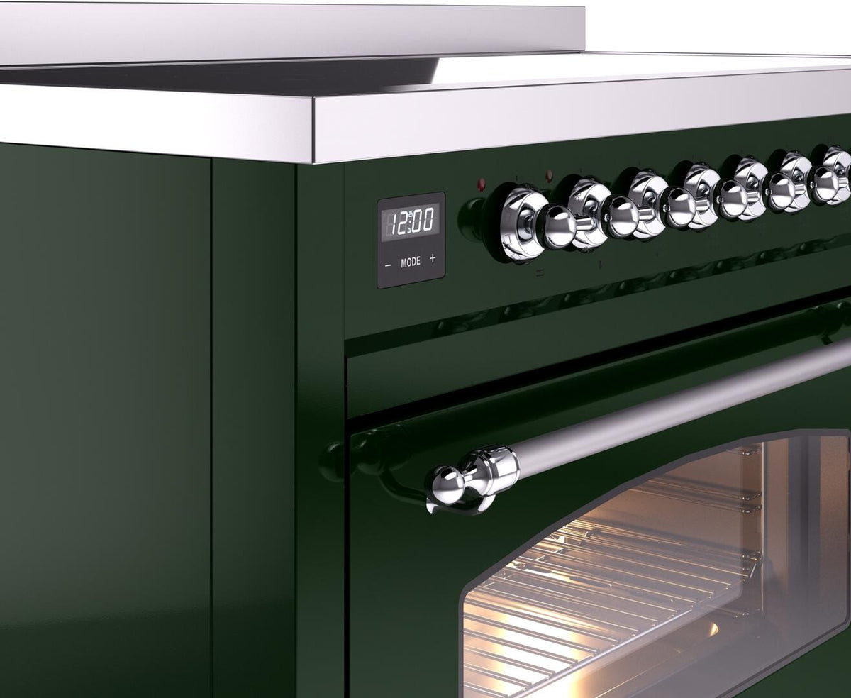 Freestanding electric induction range control area with chrome knobs and digital clock