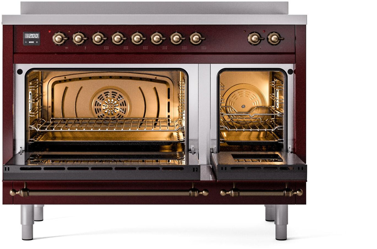 Freestanding induction range with oven doors open showing two lit compartments