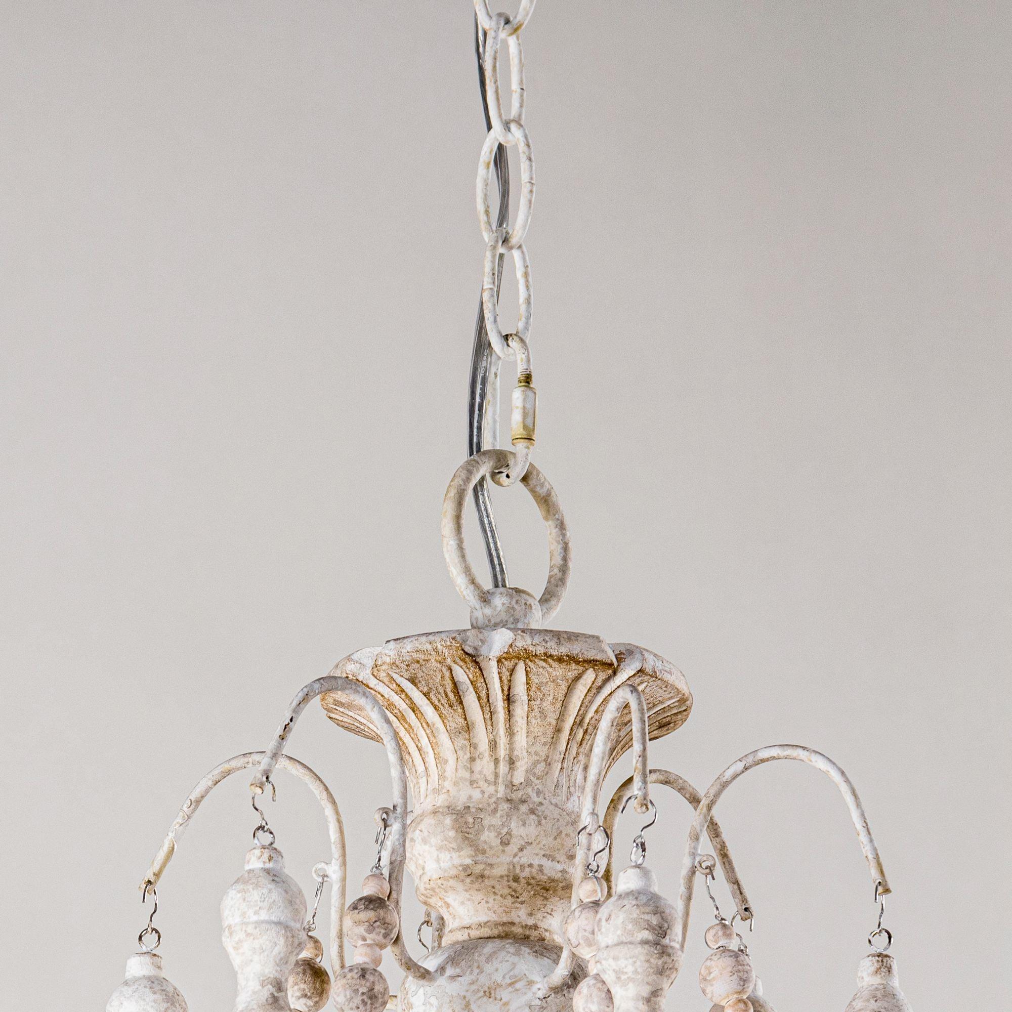 White chandelier canopy with hanging bead strands and metal chain support