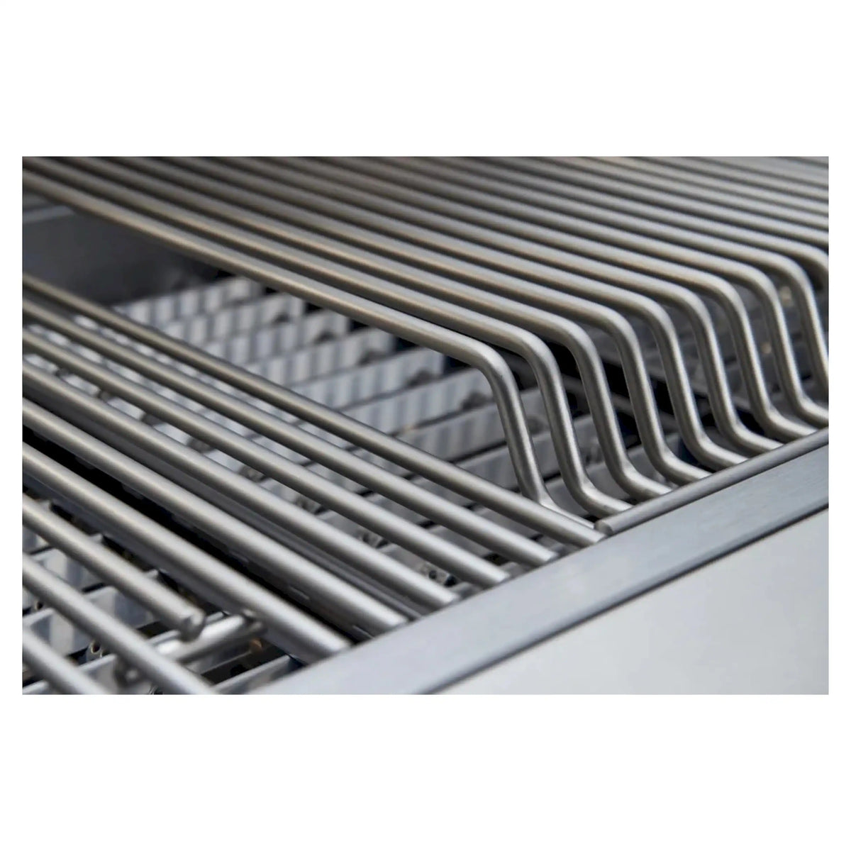Stainless steel cooking grates with curved metal rails in grill firebox