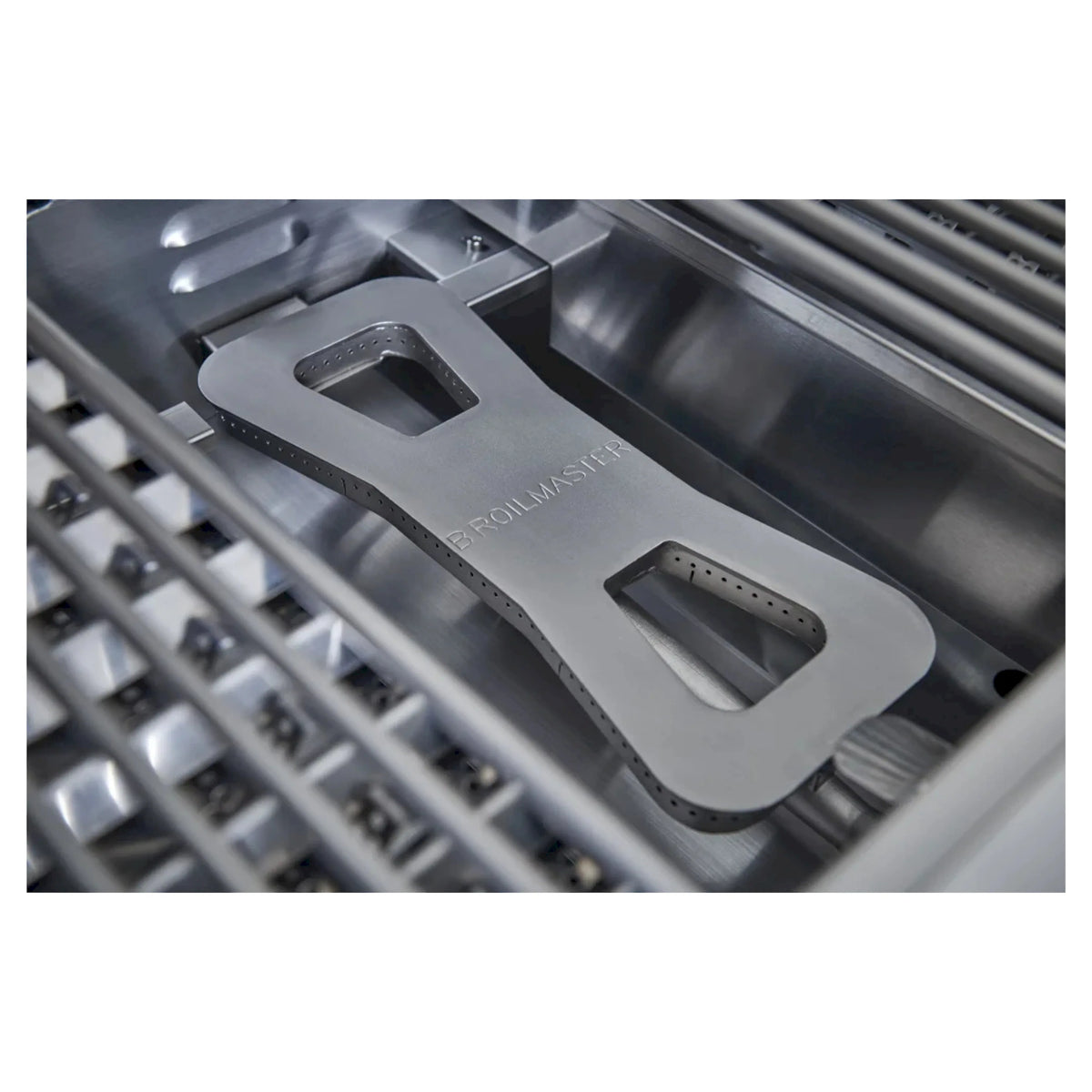 Stainless steel burner panel with handle cutouts and etched grill logo