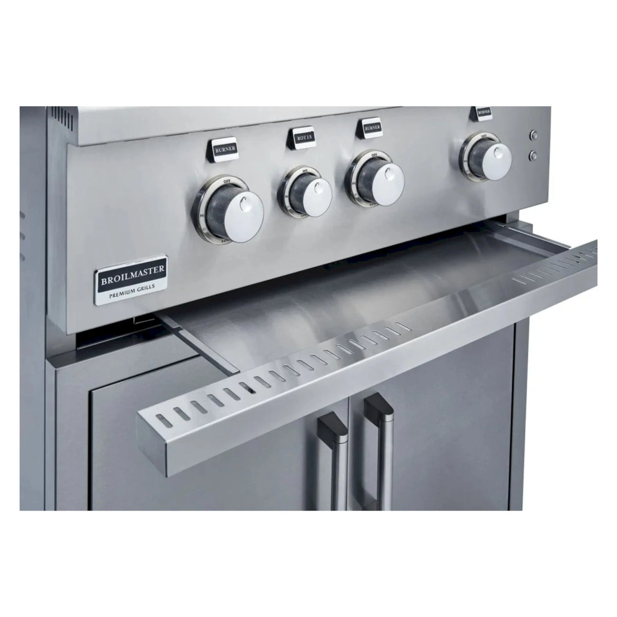 Stainless steel front control panel with three knobs and warming tray area