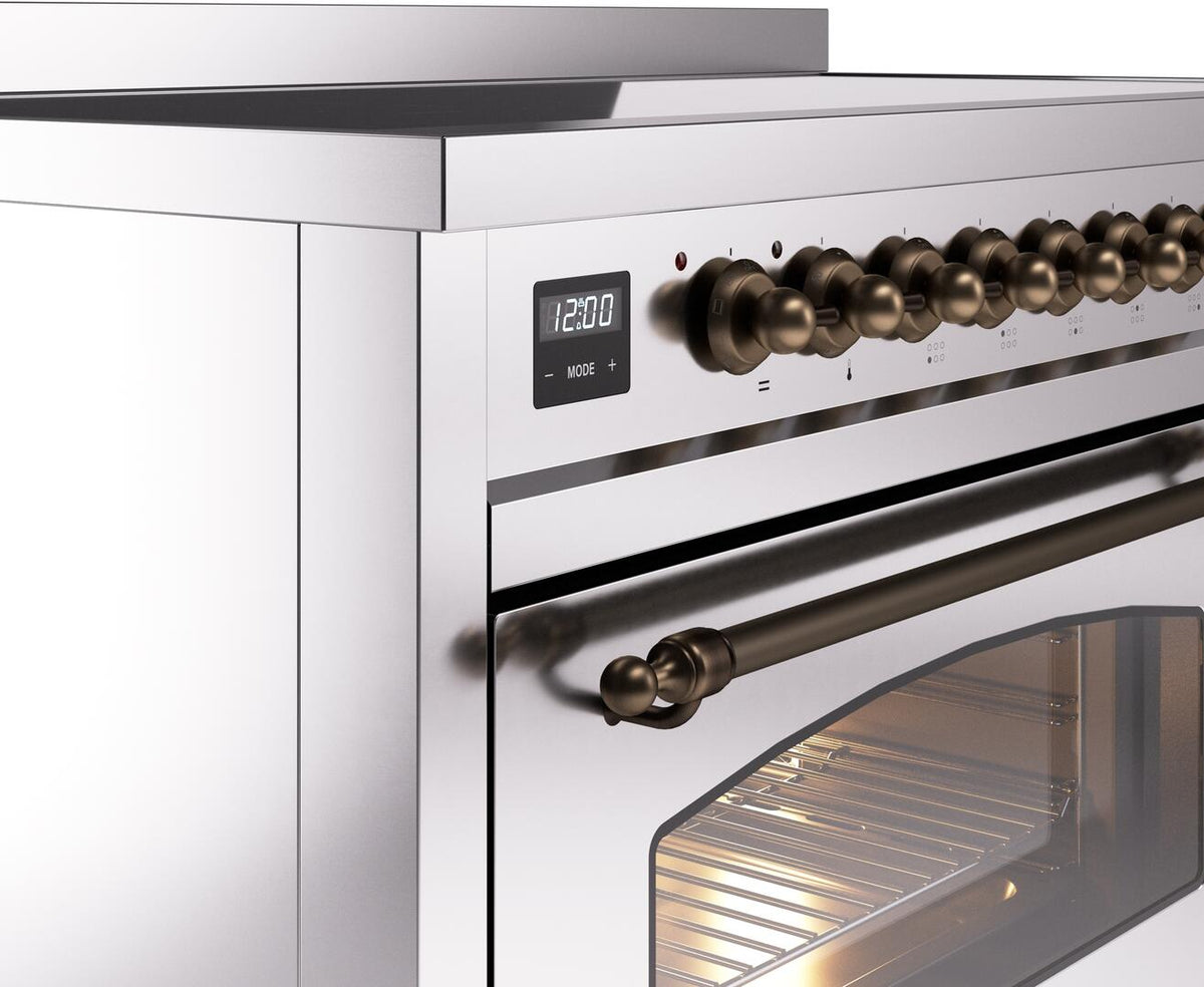 Electric induction range control panel with bronze knob row and oven door handle