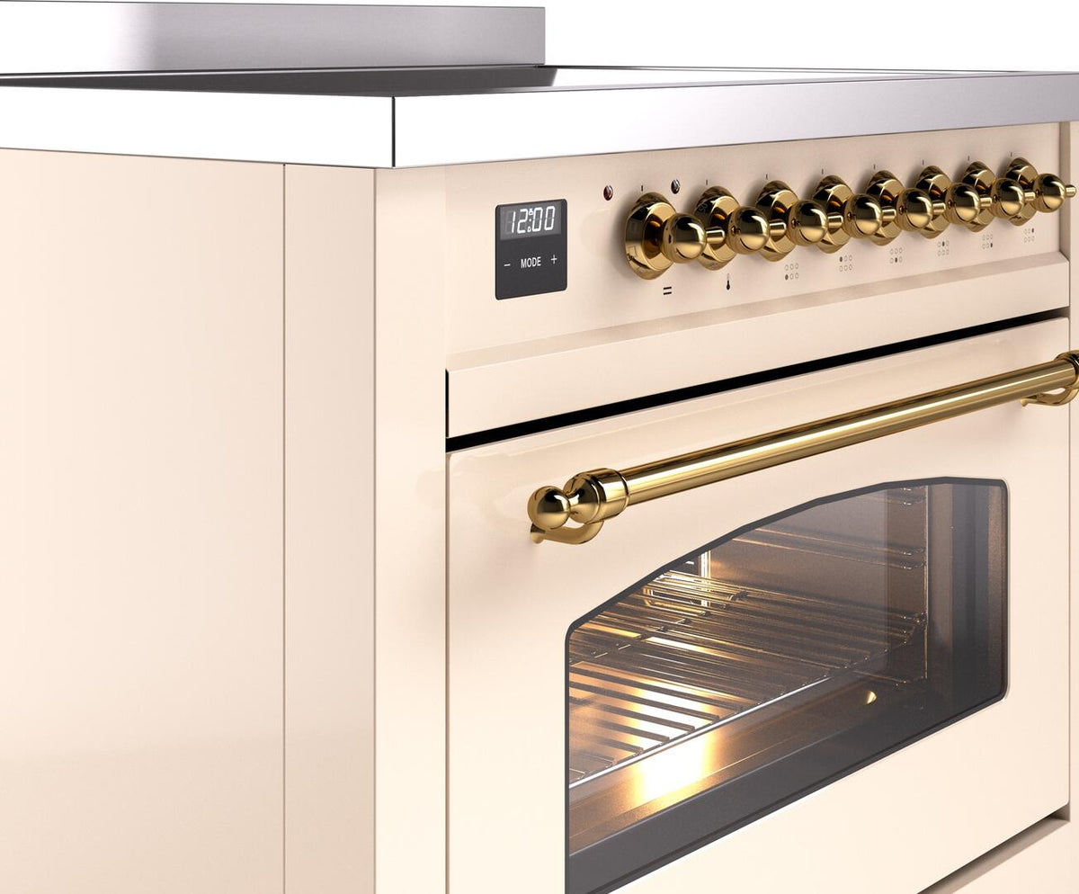 Antique white range cooktop with brass knobs and oven door window