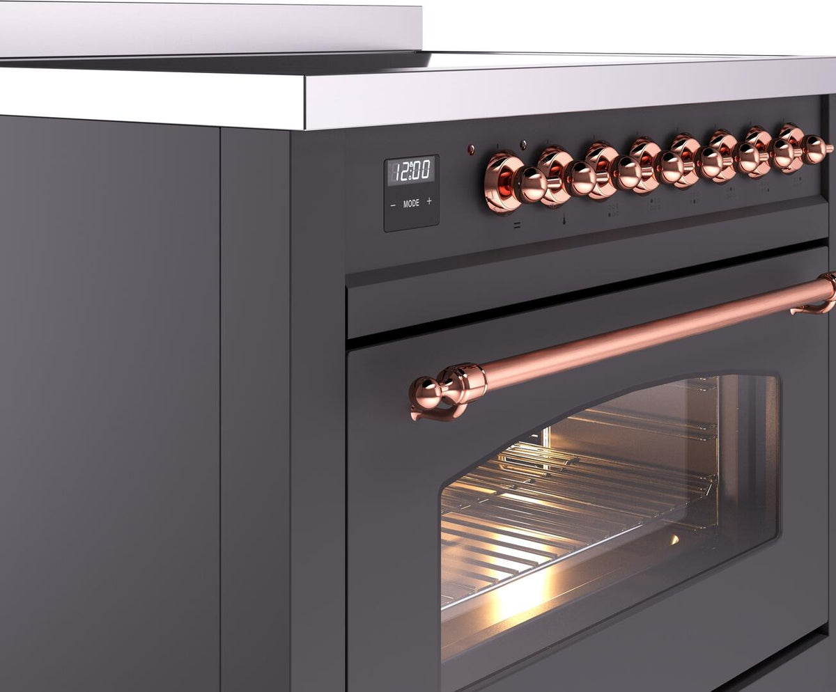 Matte graphite induction range side view with copper control knobs and oven handle
